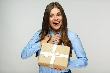 Happy business woman holding gift box.