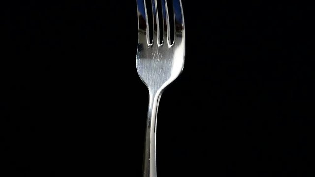Fusilli, pasta on black background