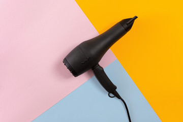 Hairdresser tools on a colored background with copy space