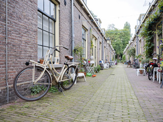 narrow street with small houses in centre of dutch town utrecht in holland