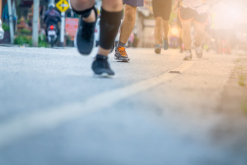 Legs of people on marathon running. Run for health.