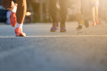 Legs of people on marathon running. Run for health.