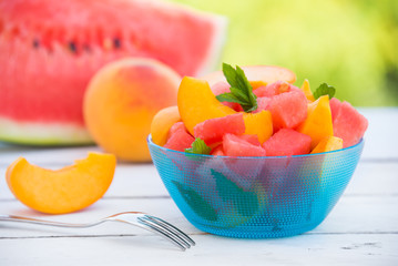 Fresh summer fruit salad with watermelon and peach