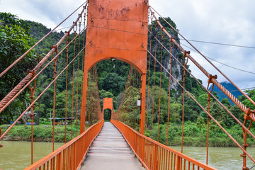 orange bridge and river in Vang Vieng Lao