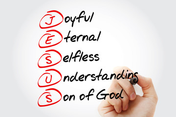 Fototapeta premium Hand writing JESUS - Joyful Eternal Selfless Understanding Son of God, acronym concept with marker