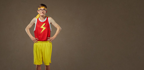 A thin, funny guy in sports clothes and glasses.
