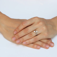 A woman's hand with silver rings and colored semi-precious stones