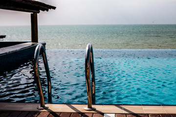 Swimming pool and metal handrail, bar on a pool with Black Sea view 