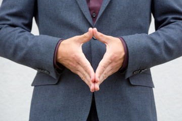 Close up hands of a male public speaker while giving a speech. 