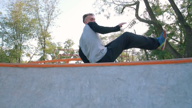Young man doing parkour tricks in extreme sports park