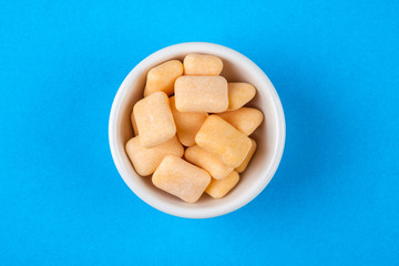 Colored chewing gum in a bowl
