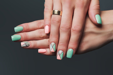 Geometry nail art design in pink and green colors