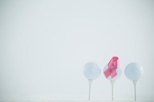 Pink Breast Cancer Awareness ribbon on golf ball