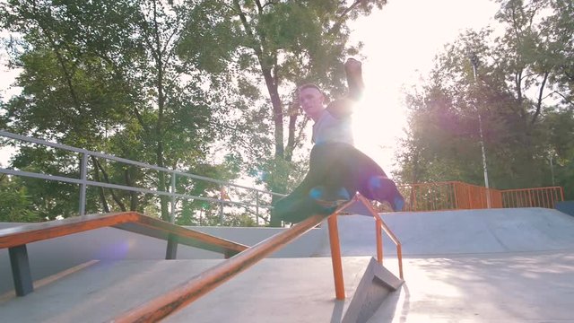Young man doing parkour tricks in extreme sports park