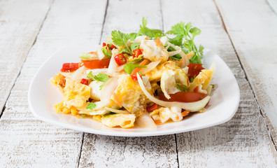 spicy salad with fried eggs