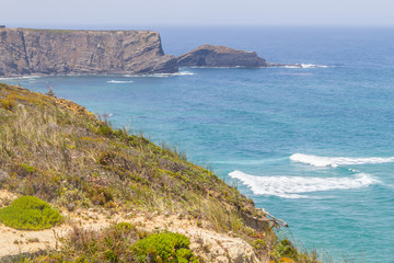 Cliffs, beach and waves in Arrifana