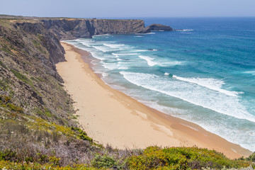 Cliffs, beach and waves in Arrifana