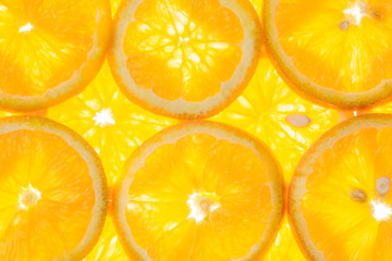 bright orange background of slices of juicy oranges.