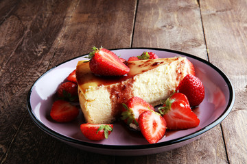 Homemade cheesecake with fresh strawberries and mint for dessert - healthy organic summer dessert pie cheesecake. Vanilla Cheese Cake.