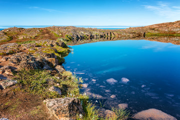 beautiful mountain lake, mirror water surface, blue sky