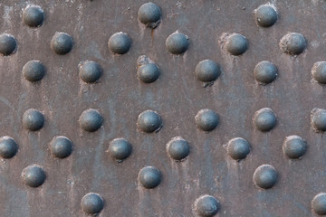 Rusty metal surface with hemispherical texture