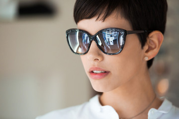 Beautiful young perfect model posing in fashion sunglasses