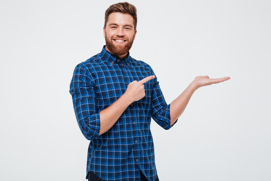 Excited Smiling Bearded Man Pointing Finger