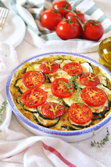 Zucchini and tomatoes gratin with bechamel sauce and cheese