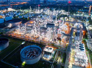 Fototapeta premium Aerial view of twilight of oil refinery ,Shot from drone of Oil refinery and Petrochemical plant at dusk , Bangkok, Thailand