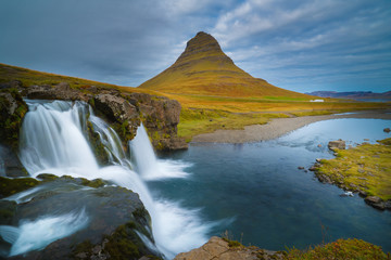 Beautiful of Kirkjufellsfoss waterfall with Kirkjufell mountain in the background on the north, Iceland