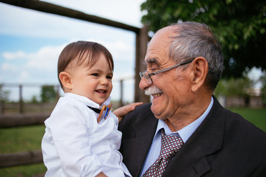 Great grandfather playing with his great grandson
