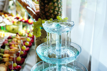 Mojito cocktail. little fountain pours a cocktail