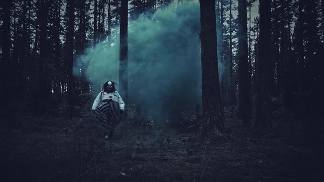 4K Halloween Horror Clown in Forest Walks in Smoke