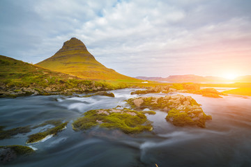 Beautiful of Kirkjufellsfoss waterfall with Kirkjufell mountain in the background on the north, Iceland