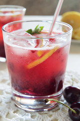 Homemade cherry lemonade in glasses macro
