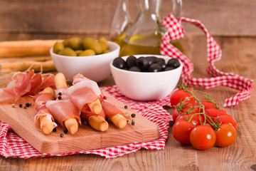 Grissini breadsticks with ham. 