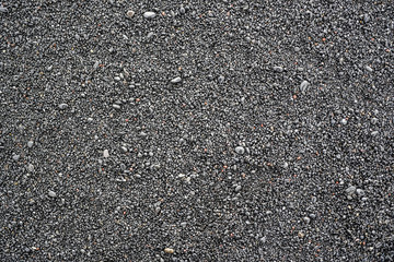 Black stones on a black beach in Iceland texture