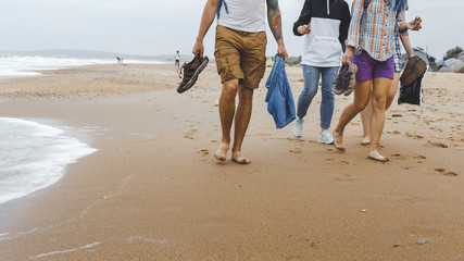 Friends Walking Along The Beach. Travel Tourism Journey Outdoor Concept