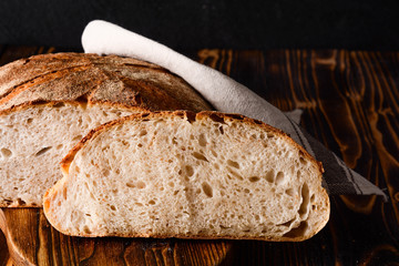 Homemade bread on a wooden background. Style rustic.