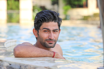 Young man in swimming pool