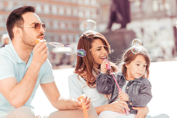 Happy family relaxing at the city.