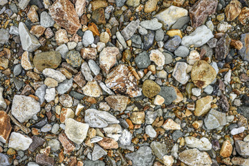 Texture of different sizes of colored stones, Iceland.
