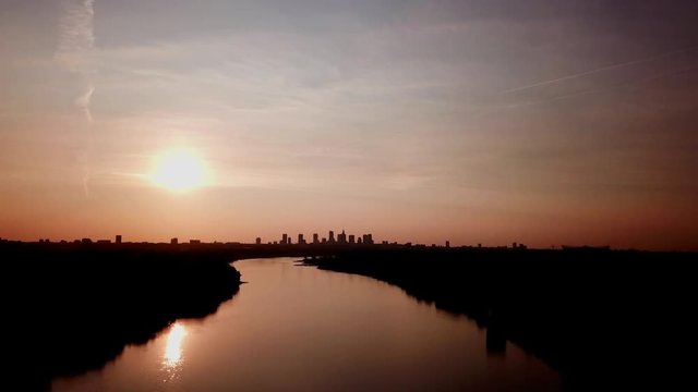 Beautiful sunset to night transition over city of Warsaw downtown skylin. Over Vistula River