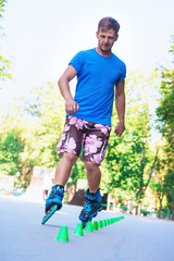 Inline roller skater on a slalom course