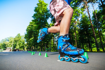 Inline roller skater on a slalom course