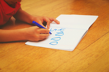child learning to write numbers