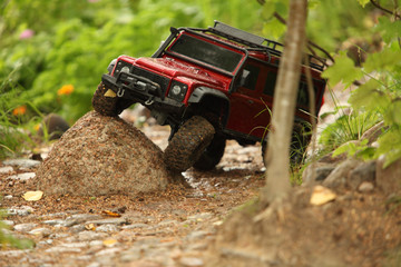 Off-road vehicle go around obstacles, radio controlled car - obrazy, fototapety, plakaty