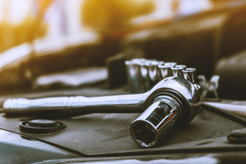 wrench ratchet placed in front of the engine Prepare for engine maintenance.