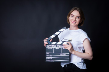 young girl with a clapperboard cinema