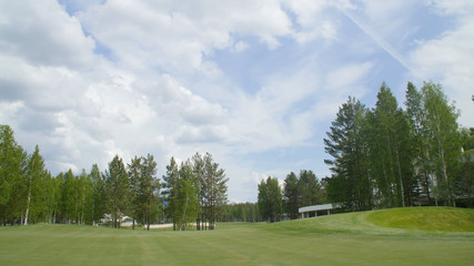 Obraz premium Solar Golf cart with clouds on blue sky and forest lake Golf club